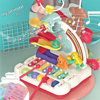 Centre de jeux en développement piano, xylophone, balles, vers magnétiques
